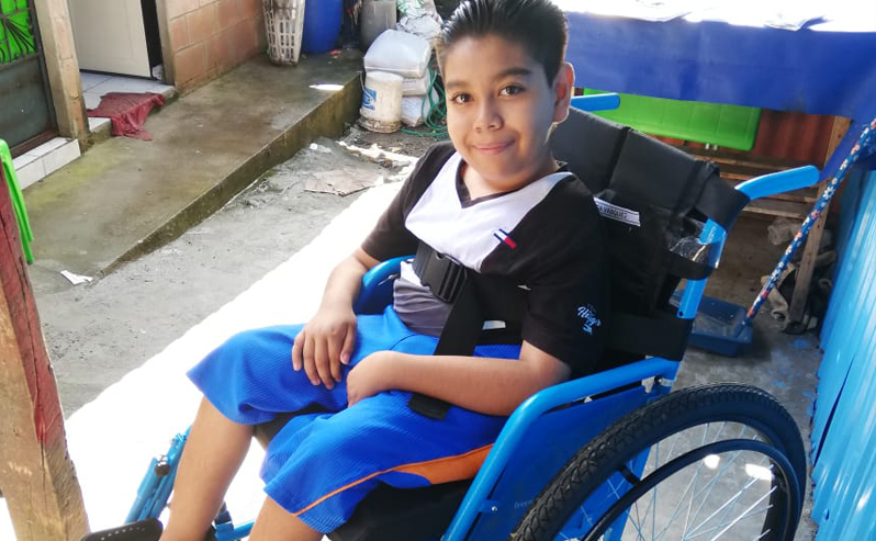 A 12-year-old boy in El Salvador gets a new wheelchair.