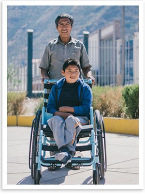Miguel, who has cerebral palsy, receives a new wheelchair in Peru.