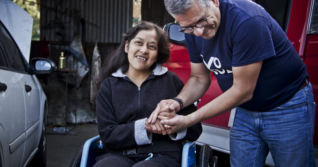 A young woman who lost mobility to kidney failure receives a wheelchair in Mexico.