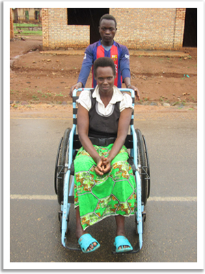 A woman in a wheelchair in Burundi. She lost mobility to malnutrition.