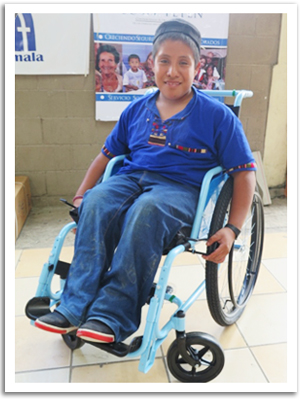 Darwin, a teenager in Guatemala who was born with spina bifida and just received a wheelchair.
