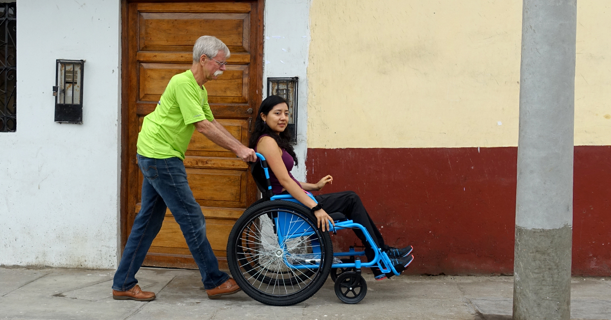 A young woman in Peru who lost mobility to a spinal cord injury receives a wheelchair.
