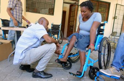 Solange gets fitted with a new wheelchair in Haiti.