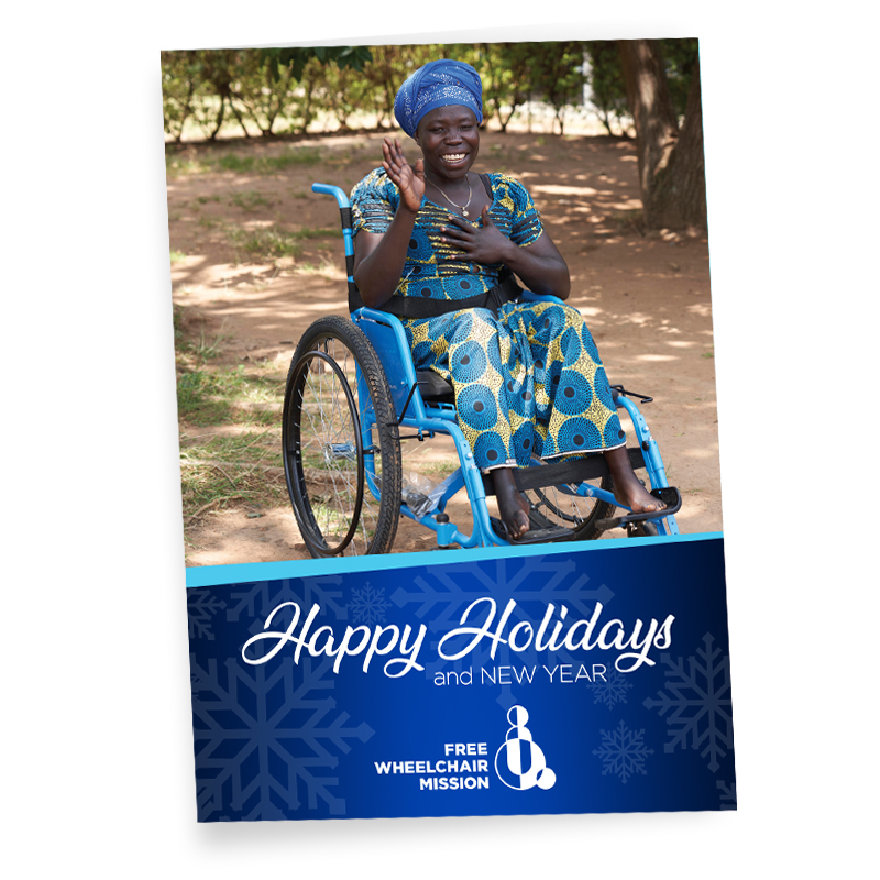 A greeting card saying Happy Holidays, with a woman dressed in blue, in a wheelchair.