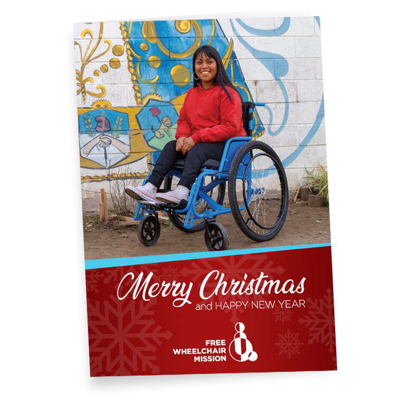 A greeting card saying "Merry Christmas and Happy New Year" from Free Wheelchair Mission.