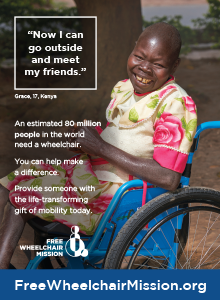 A smiling Kenyan woman in a blue wheelchair.