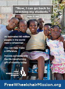 A Haitian schoolteacher with her students, in a blue wheelchair.